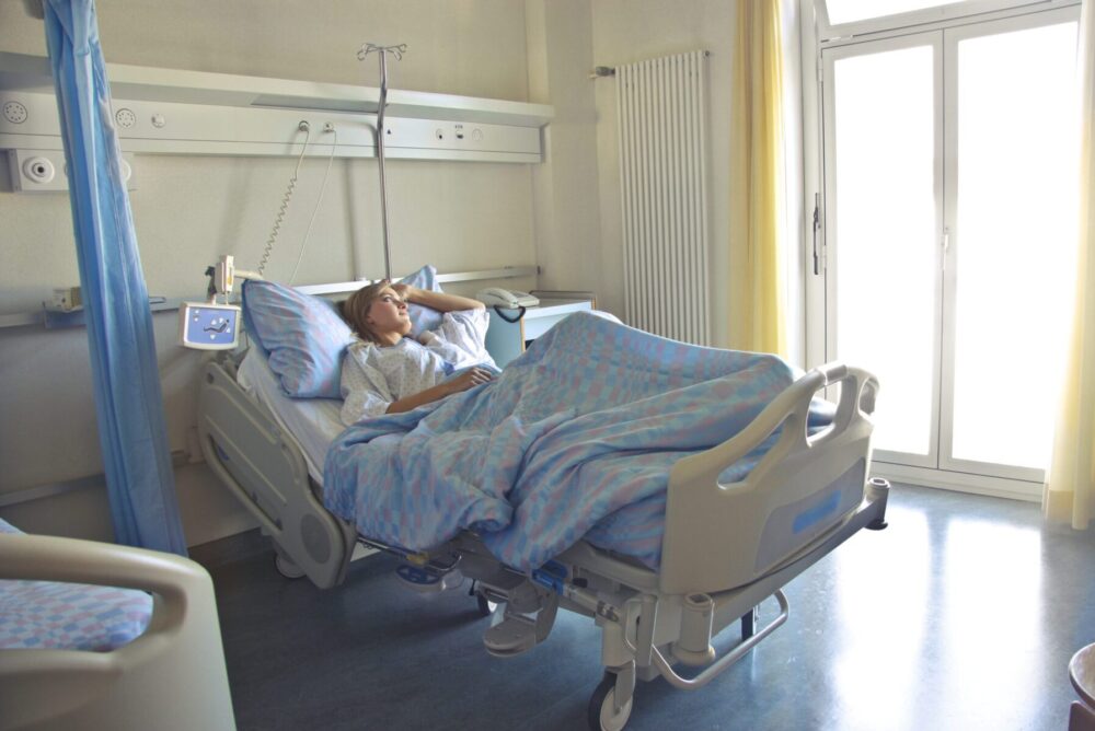 photo-of-woman-lying-in-hospital-bed-3769151
